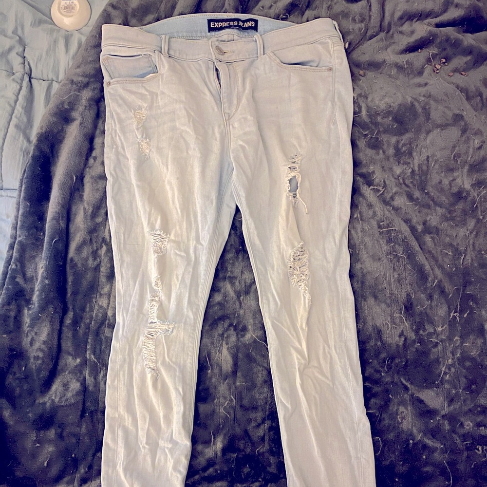 Express Jean/leggings size 12 with 29”inseam. Light wash with holes in knees.
